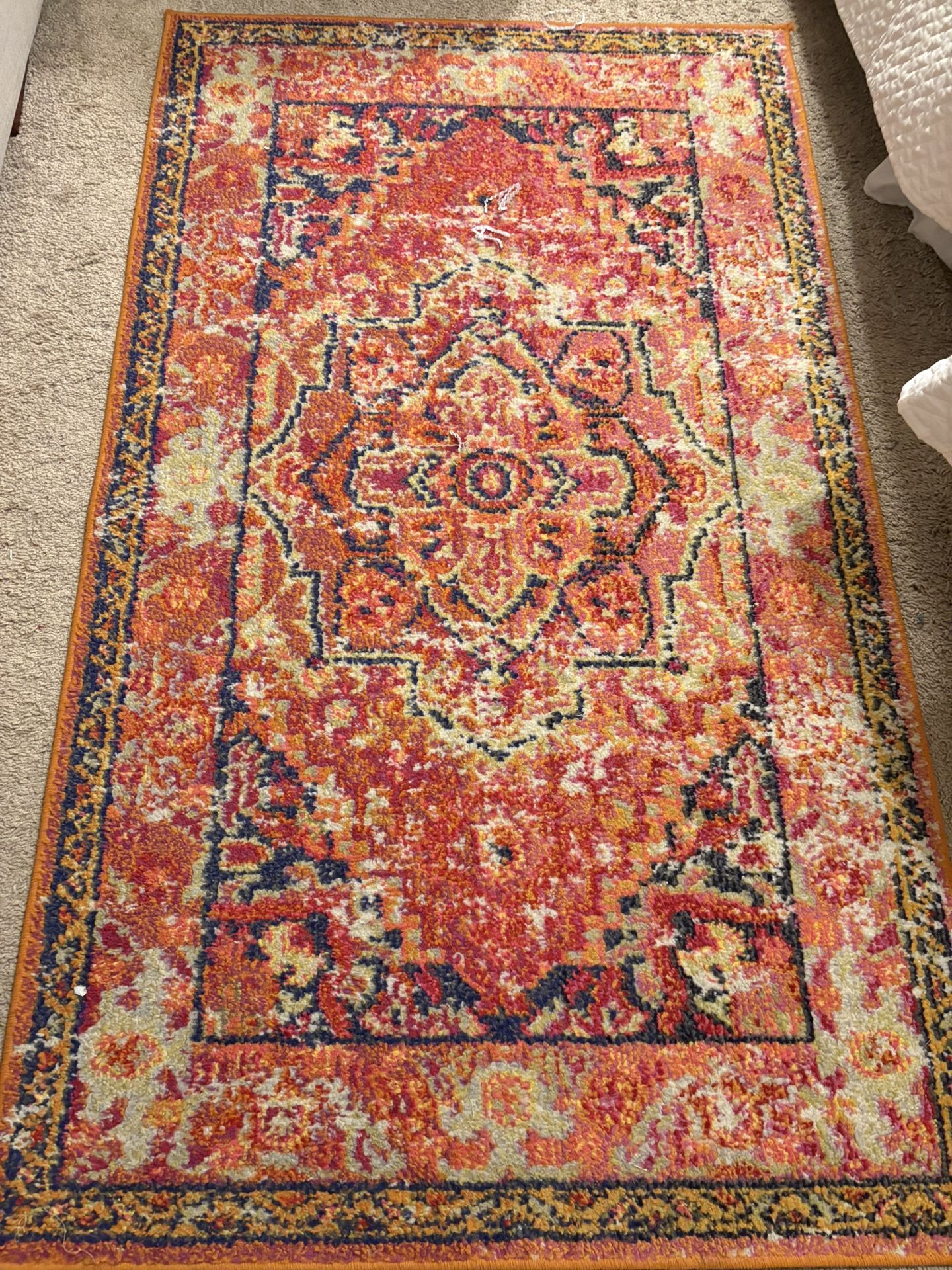 Orange Rug And Accessories For A Bedroom