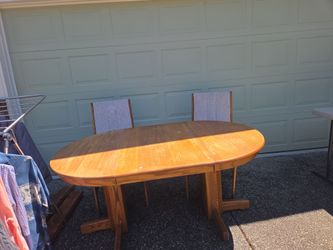 Oak dining table and two chairs