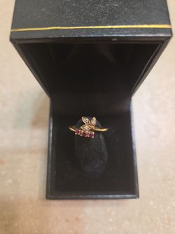 10 k gold rubies and diamonds ring.  Weight is 2.2 grams