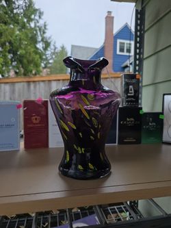 Bust form purple vase