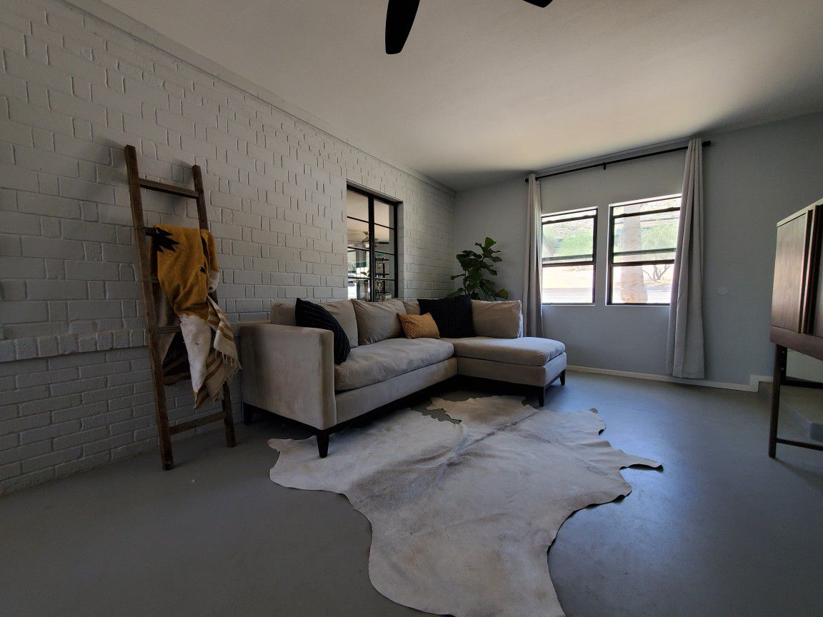 White and gray cowhide rug