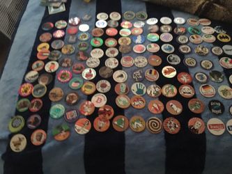 Over 130 pogs plus 3 collectible flippers