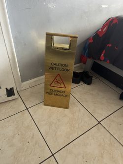 Gold wet floor sign