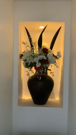 Dark Brown Ceramic Vase with Floral Arrangement