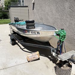 Boat w/ Rebuilt motor & Trailer