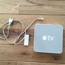 Apple TV 1st generation with remote and power cord.
