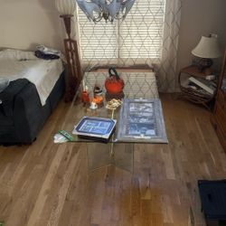 Beveled glass table with metal frame and chairs.
