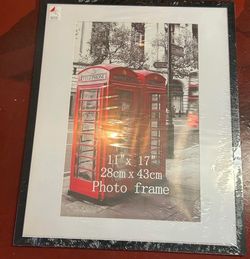 - 11“ x 17“ photo frame matted for 10.5” X 16.5 in overall frame is 21 in tall X 17 in wide (B-3)