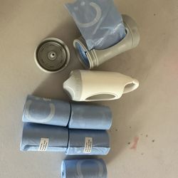 Ubbi On-the-Go Gray Bag Dispenser and Waste Disposal Bags Refill, 60 Lavender Scented Diaper Bags, Baby Savings Bundle +Munchkin  Diaper Bag Dispenser