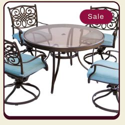 Hanover Traditions 5-Piece Outdoor Dining Set with 4 Swivel Rockers, Cushions and 47 in. Glass-top Table