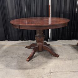 Brown Wood Round Pedestal Extendable Dining Table