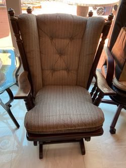Two upholstered wood rocking chairs