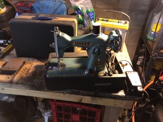 Old vintage sewing machine sewing