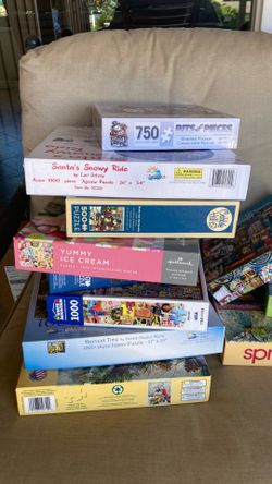 25 more 1000 piece like new puzzles