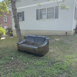 Free Black Leather loveseat Couch With Attachable Wheels