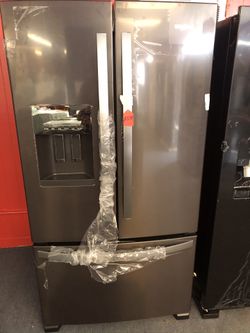 New scratch and dent whirlpool stainless steel 24 cu ft fridge. 1 year warranty
