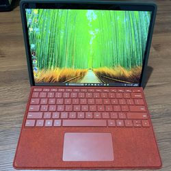 Microsoft Surface Pro 9 5G 13” touch tablet and keyboard and surface pen.