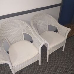 Two White Chairs With Cushions 