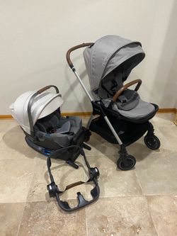 Nuna Triv Stroller with Car Seat with white canopy