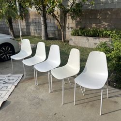8 White Chairs