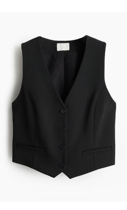 H&M Short, fitted vest in woven fabric. V-neck, buttons at front, and welt front pockets. Princess seams at front for a flattering silhouette. Lined.