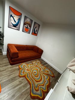 Sturdy sofa bed with assorted rug and frame + dining room wall art