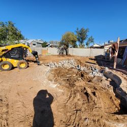 Skid Steer Bobcat And Dump Trailer