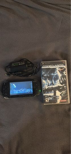 PSP 1001 w/ memory stick, charger, 1 game and 1 movie