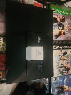 PS2 (slim) with 8 great games (PS1 and PS2 all tested and work)