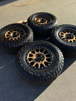 FINANCING AVAILABLE Method MR305 18" 6x5.5 Wheels with 35" Nitto Recon Grappler All-Terrain Tires