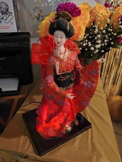 Japanese geisha doll light red and gold patterned kimono