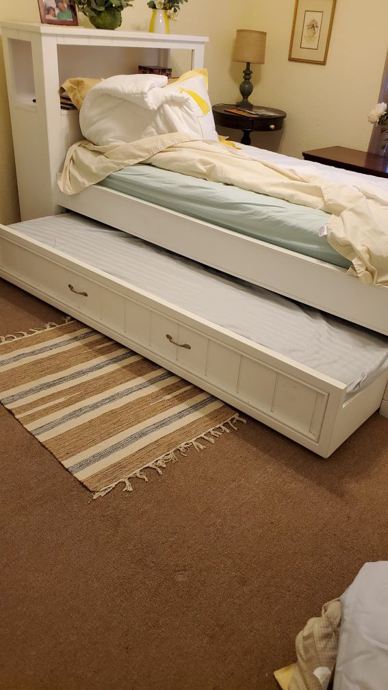 Twin trundle with shelves and extra mattress!