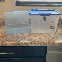Two Storage Containers With Attached Lids