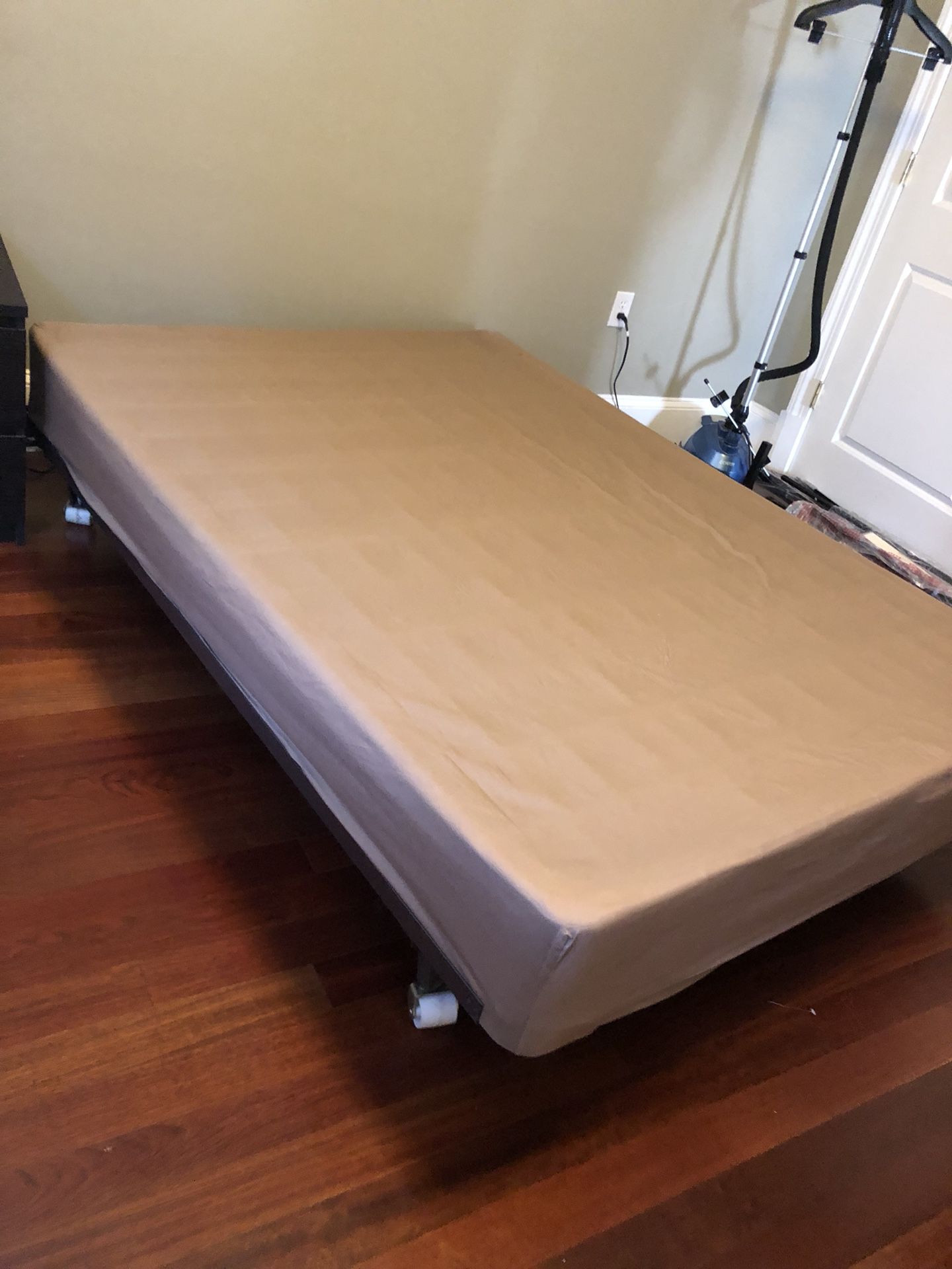 Full box spring and metal bed frame on wheels