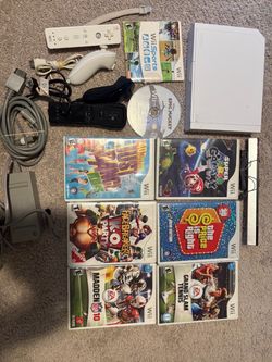 Nintendo Wii + 8 games (hablo espanol)
