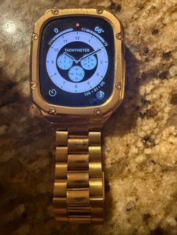 Apple Watch Ultra 49mm Titanium Case with gold band &  Midnight Ocean Band