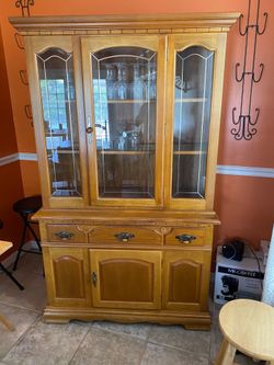 $125/OBO Elegant wooden china cabinet with glass doors and shelves. (contact info removed).