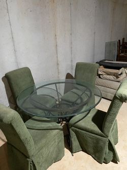 Modern Circular Glass Dining Table with Sculptural Metal Base