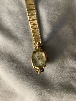 vintage Bulova ladies' cocktail watch from 1968, paired with a vintage stretch bracelet