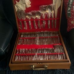 Brass flatware from the 60s never been open serving for 12