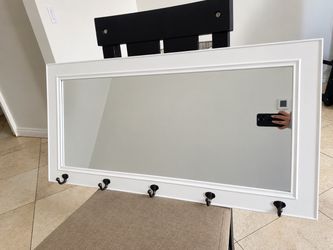 Mirror with hangers