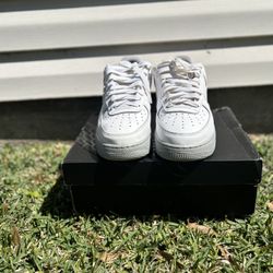 White and grey Nike Air Force 1 trainers