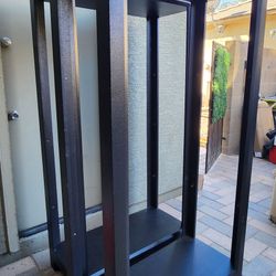 Black lighted display cabinets with glass shelves. 