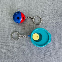 2 vintage Tupperware key chains  Both are in like new condition