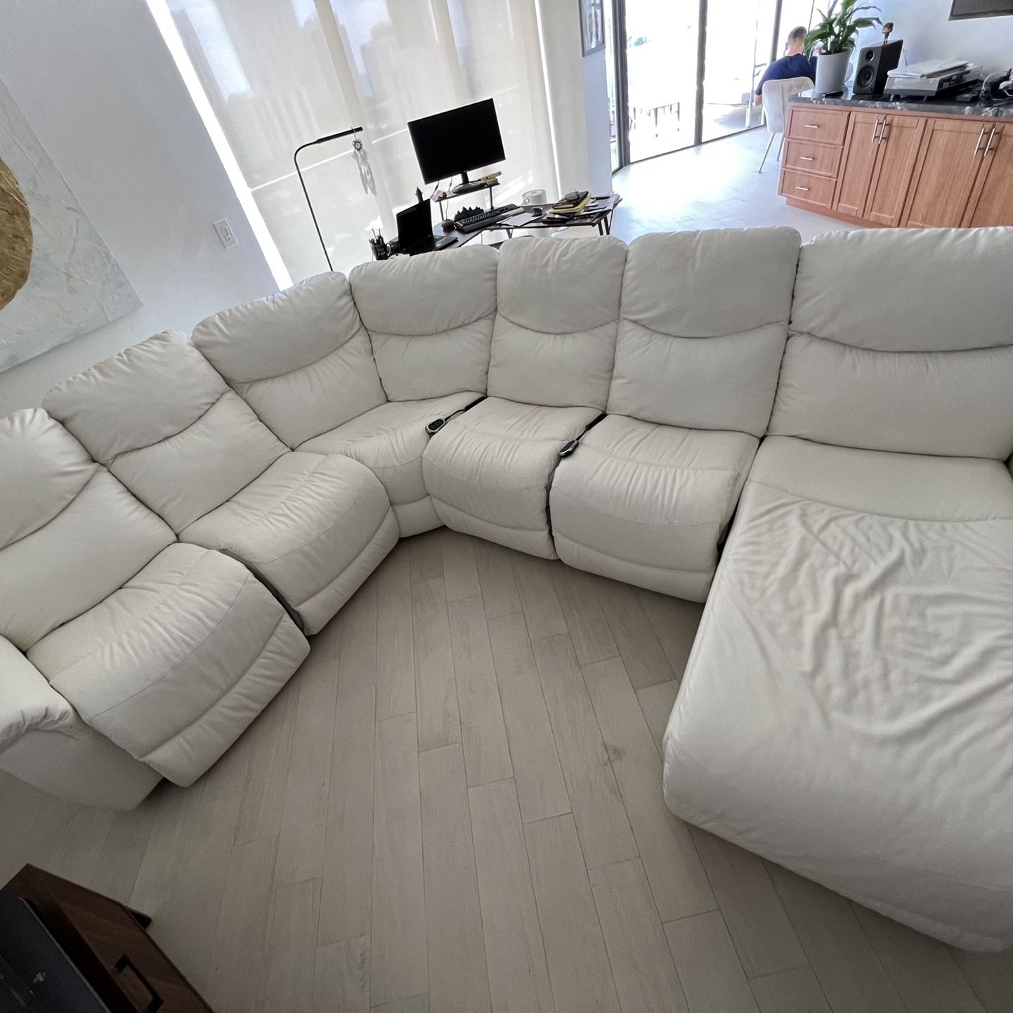 White leather sofa. Motorized