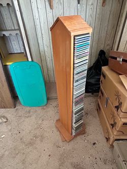 CD tower holder with random CDs.