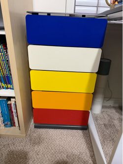 MoMA metal rainbow pivot cabinet.