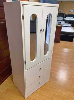 Tall white  closet with mirrors ((