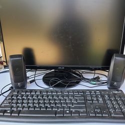 26" computer monitir, keyboard, and speakers
