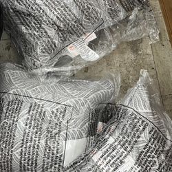 Three brand new Sunbrella pillows in package 